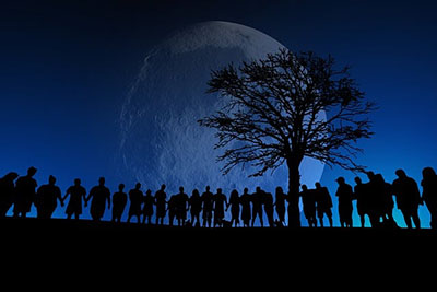 people standing in line across the image with a tree towards the right and the moon behind them